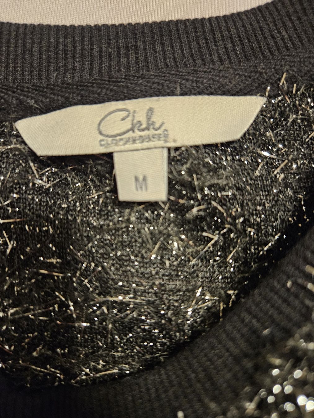 C&A Pulls & Sweat-shirts: Glitzerpulli schwarz/silber Gr. M – D'occasion à St. Gallen par Rebiili 1