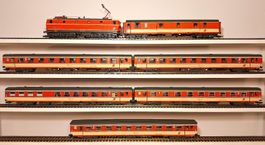 ÖBB 1044 mit Inlandwagen "Neue Generation" Jaffa-Lackierung