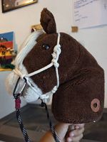Steckenpferd mit Ton an den Ohren