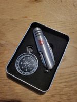 Taschenmesser und Kompass mit Schweiz Logo in Metalldose