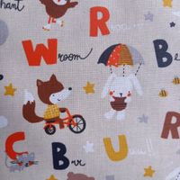 Beschichtete Baumwolle Buchstabentiere beige