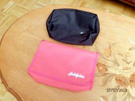 2 Necessaire, Kulturtaschen von Hotelplan, rot und schwarz