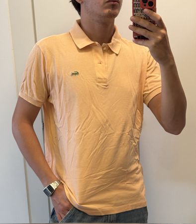 Polo Lacoste homme saumon taille M bon état