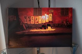 Canvas photography of an asian artist on the street