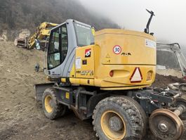 Bagger , New Holland MH City 20 to
