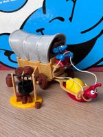 Cowboy-Schlumpf mit Westernwagen und Feuerstelle