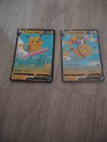 Surfendes und ein Fliegendes Pikachu V