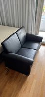 Schwarzes Ledersofa