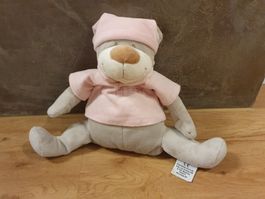Teddy mit rosa T-shirt und Schlafmütze mit Tasche