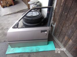Peugeot 205 Fahrertüre mit Rost ohne Beule