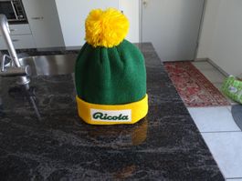 Ricola Mütze grün gelb mit Bommel NEU