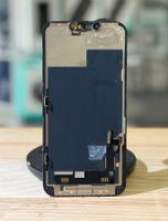 Ecran original léger fissuré au coin pour iPhone 13
