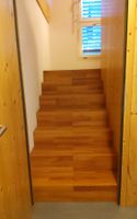 Holz Treppe  aus  3-Schichtplatten mit Parkett belegt