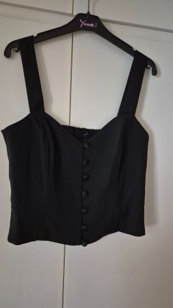 Gilet noir avec boutons, sans manches, très bon état