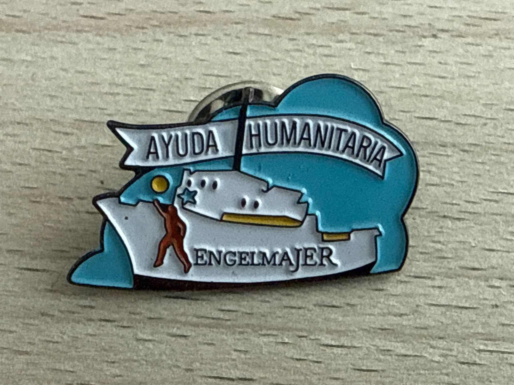 Plaketten & Abzeichen: Pin Ayuda Humanitaria Engelmajer – Gebraucht aus Glattbrugg von Schweigmatt