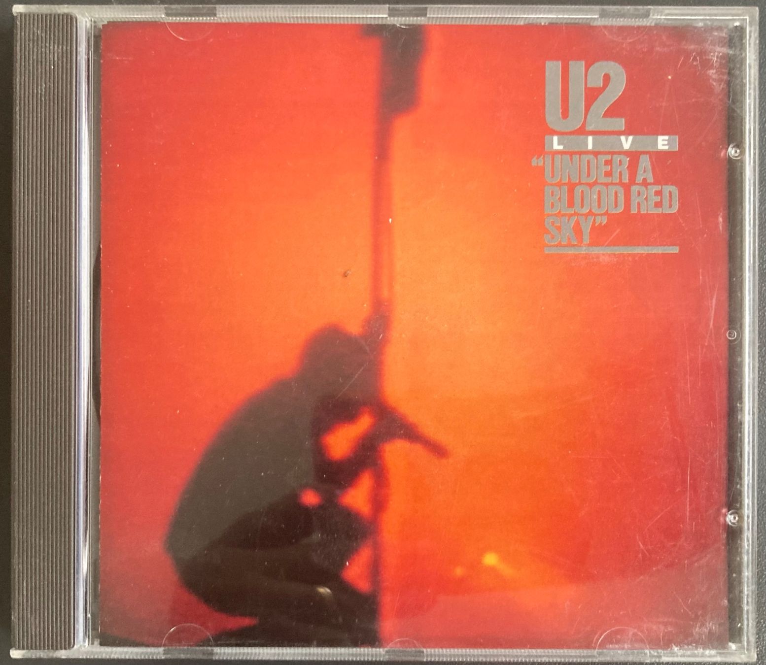 CDs: U2 - LIVE "UNDER A BLOOD RED SKY" – Gebraucht aus Poliez-Pittet von Newtown-Records