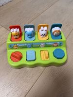 Spielzeug mit Tieren und Knöpfen Pop up Versteckspiel