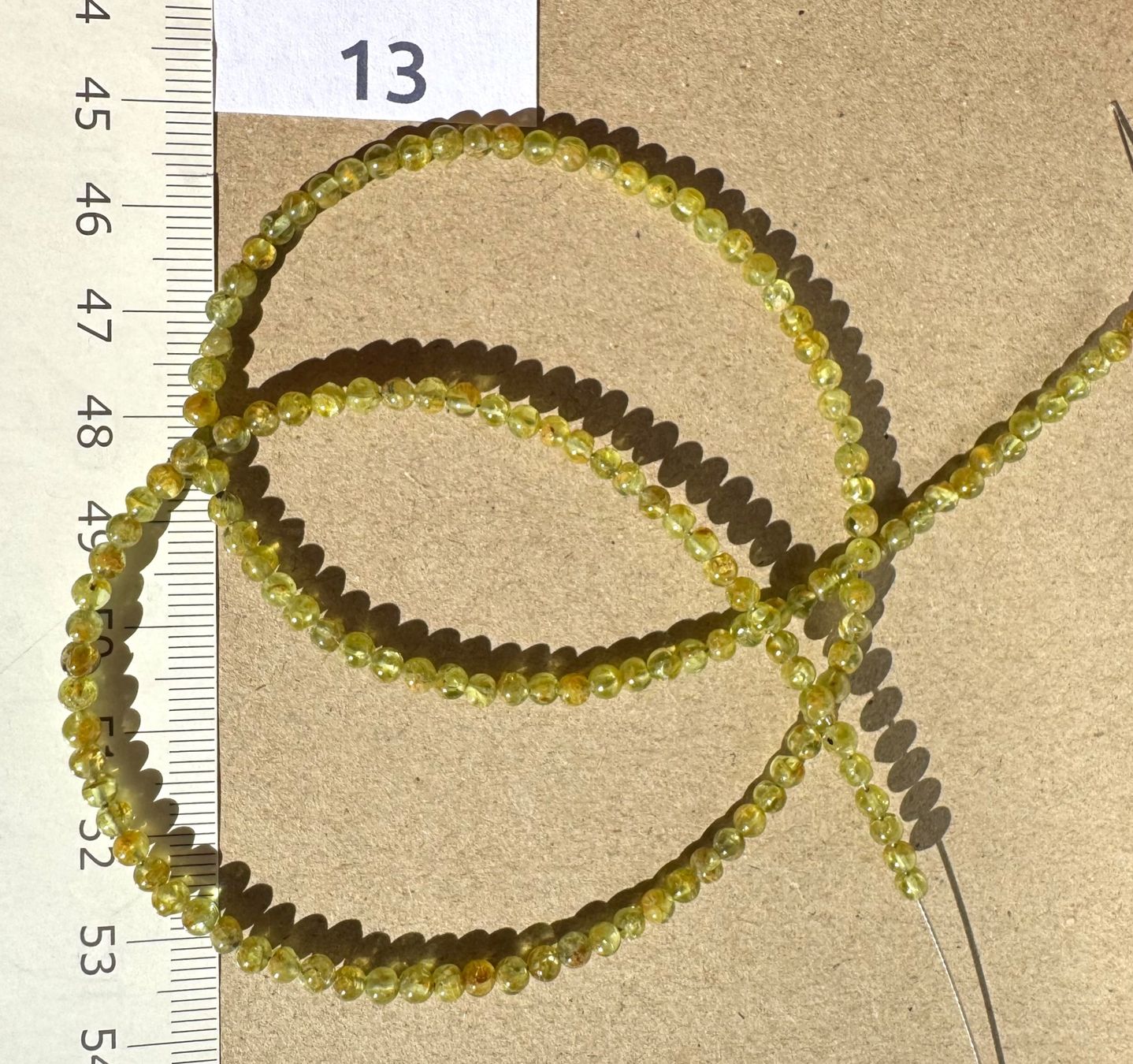 Catenine: Peridot. Olivin        extra  runde  feine Form   3mm  46cm – Nuovo e nell'imballaggio originale da Leuggern venduto da gemshow 4