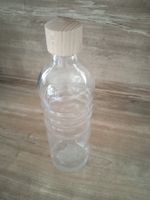 Glasflasche mit der Lebensblume