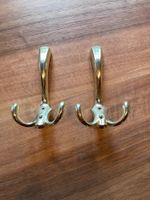 2 goldene Metall‑Wandhaken im Vintage‑Look