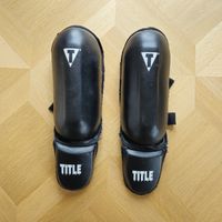 Protège-tibias TITLE, taille S, noir, bon état