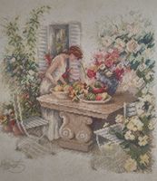 Kreuzstichbild Frau mit Früchten gerahmt guter Zustand