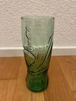 Grünes Trinkglas von Coca Cola