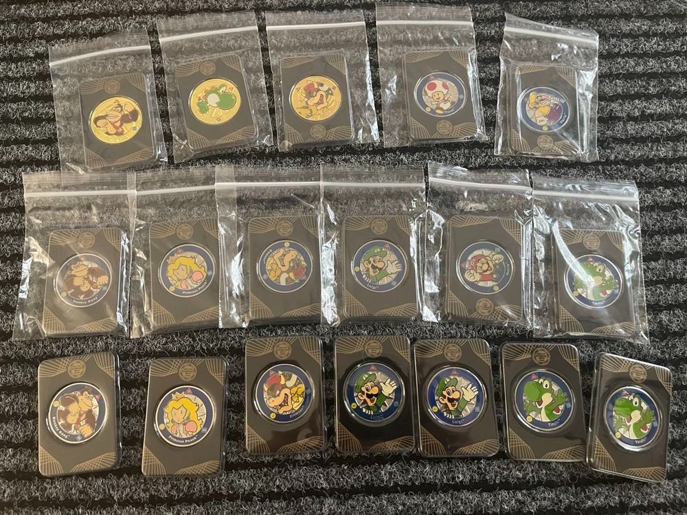Tutti le monete: 18 Stk. Nintendo Super Mario Challenge Coins + Displaybrett – Nuovo e nell'imballaggio originale da Aesch BL venduto da CollectorsBest 3