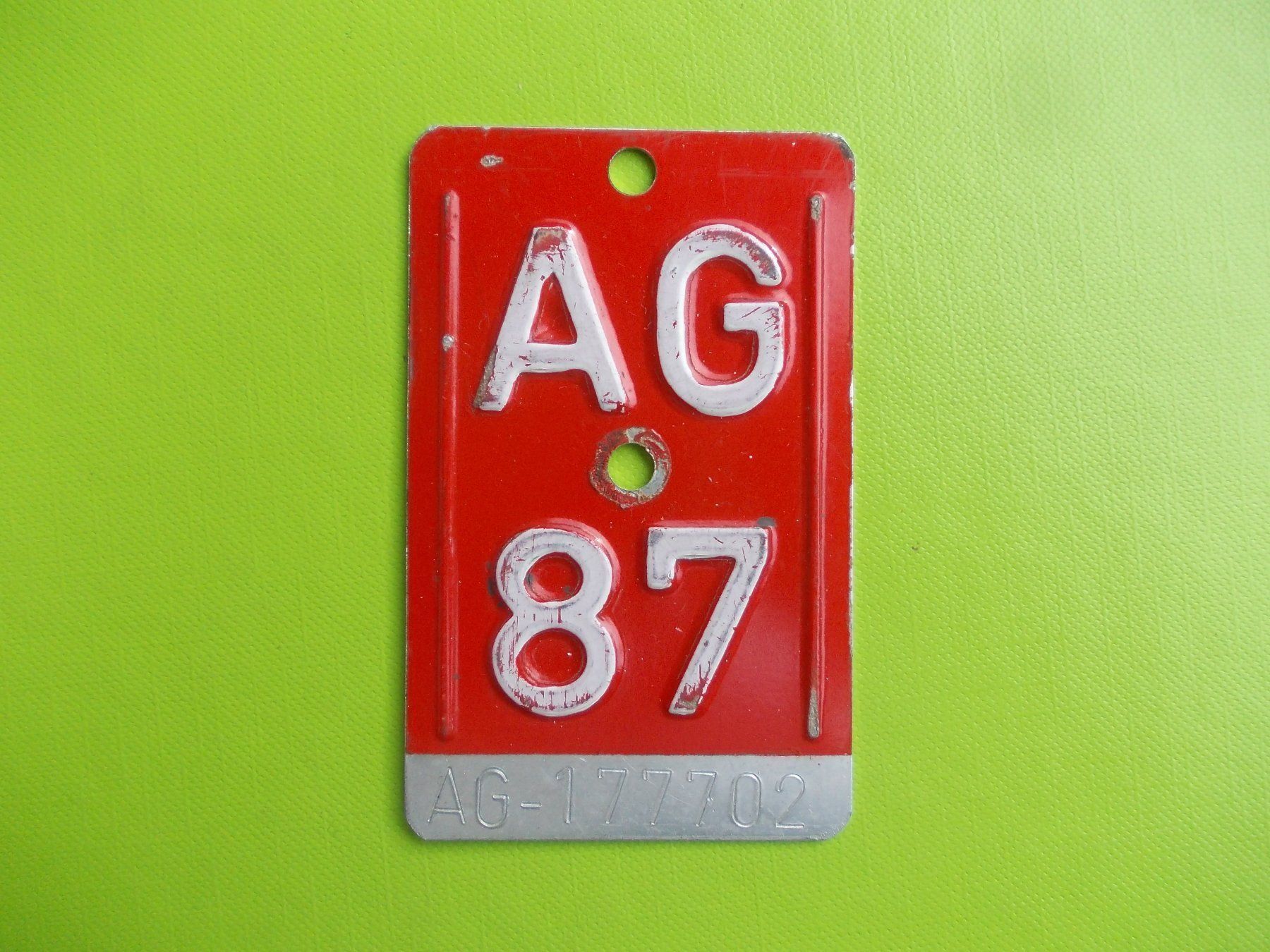 Schilder: Velonummer / Fahrradnummer AG 87 – Gebraucht aus Gsteigwiler von HORMIGA21