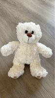 Ours en peluche blanc crème