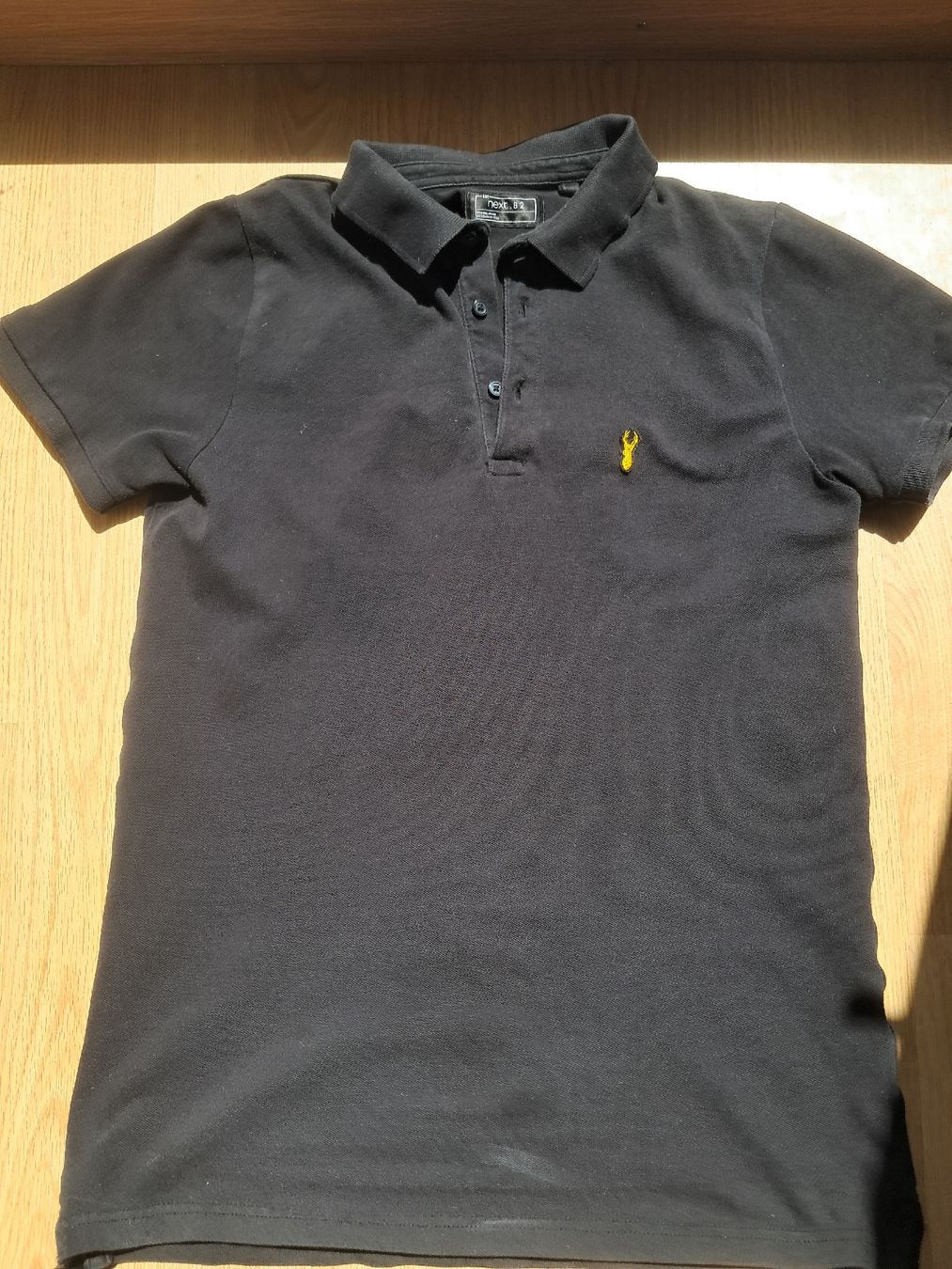 Next Chemises, T-shirts & Polos: Polohemd Next.82 schwarz  – D'occasion à Biel/Bienne par sof_yx5y