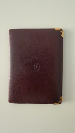 Portefeuille Cartier en cuir bordeaux, excellent état