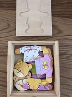 Holzpuzzle Anziehpuppen