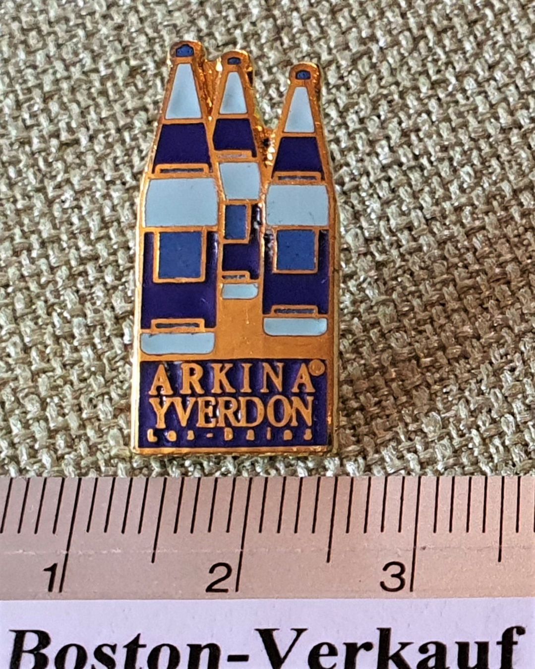 Placchette & Badge: E772 - Pin Mondo - Arkina Yverdon – Usato da Reinach BL venduto da Boston-Verkauf 1