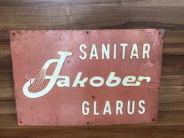 Antikes Werbeschild der Firma Sanitär Jakober Glarus