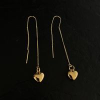 Boucles d'oreilles pendantes coeur doré 