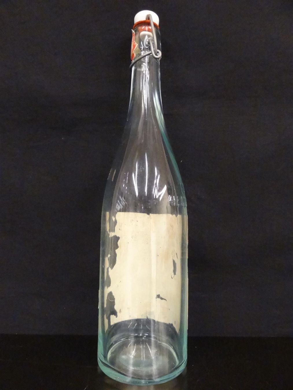 Bicchieri, Caraffe & Bottiglie: alte Flasche HENNIEZ SANTÉ – Usato da Kerzers venduto da Flaschenposten 5