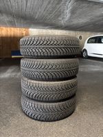 Vier Stahlfelgen mit neuwertigen Winterreifen ohne Schrauben