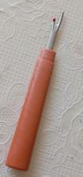 Seam ripper, orange plastic handle, new condition