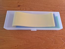 3 Fitnessbänder gelb blau und grün im Plastikbox