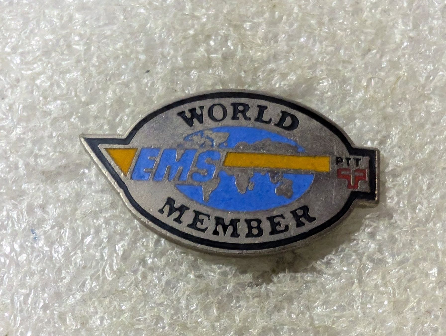 Placchette & Badge: Ansteckpin 165: PTT EMS World Member – Usato da Oppligen venduto da Pin-Fall-Shop