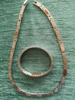 collier et bracelet MAGNETIX en acier inoxydable