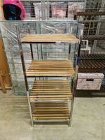 Wooden shelves with inox side support.