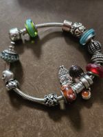 Verkaufe ein Armband mit 15 Charms silber 925
