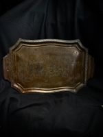 Vintage metal serving tray with relief used