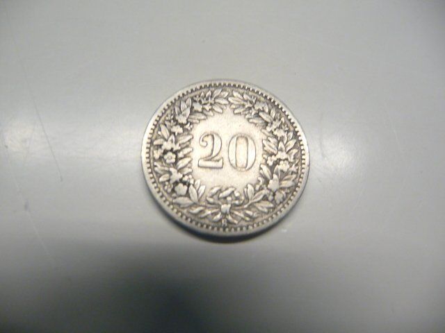 Tutti le monete: 1883  Münze 20 Rappen – Nuovo e nell'imballaggio originale da Kloten venduto da zimboida 1