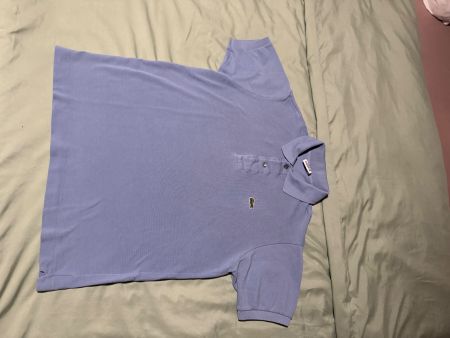 Polo Lacoste bleu ciel taille 3, état impeccable pour l'été!
