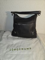 Sac Longchamp en cuir noir grainé,