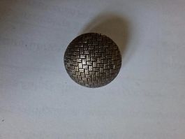 Knopf aus Metall