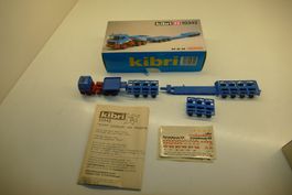 Kibri H0: MAN Tieflader mit Baggerbrücke